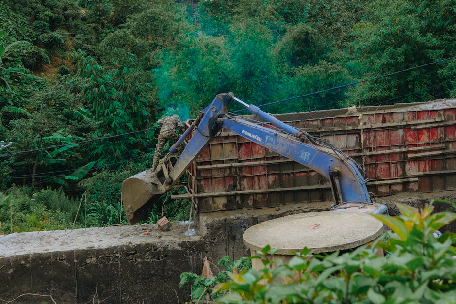 Profesjonalny montaż zbiornika betonowego przez ekipę budowlaną
